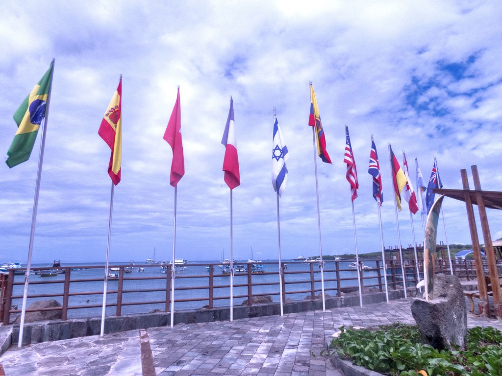 international flags on the harbor boardwalk